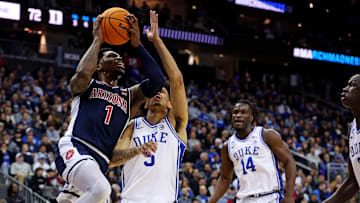 Mar 27, 2025; Newark, NJ, USA; Arizona Wildcats guard Caleb Love (1) shoots the ball against Duke Blue Devils guard Tyrese Proctor (5) during the second half during an East Regional semifinal of the 2025 NCAA tournament at Prudential Center. Mandatory Credit: Vincent Carchietta-Imagn Images