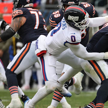 Caleb Williams gets into do-or-die mode and spins out of the grasp of Brian Burns to try and make a play Sunday.