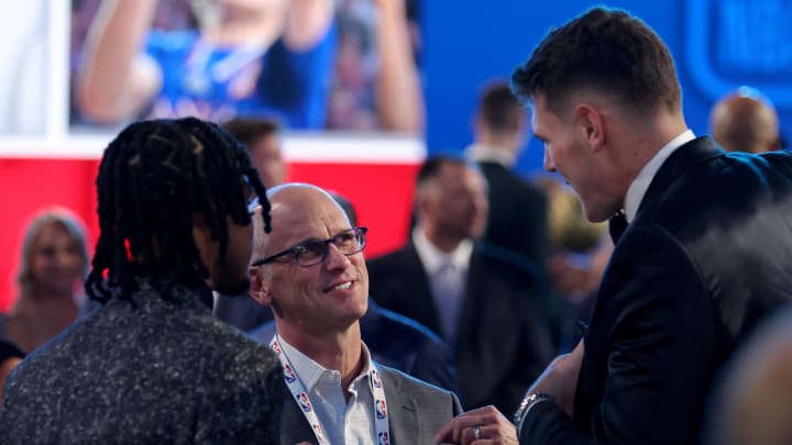 Jun 26, 2024; Brooklyn, NY, USA; Connecticut Huskies head coach coach Dan Hurley talks to Stephon Castle (left) and Donovan Clingan (right) before the start of the first round of the 2024 NBA Draft at Barclays Center. 