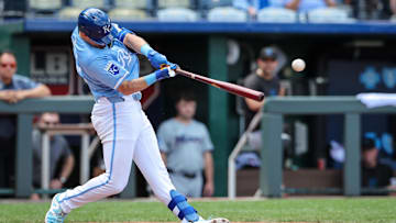 Jun 26, 2024; Kansas City, Missouri, USA; Kansas City Royals second base Nick Loftin (12) gets a hit against the Miami Marlins during the eighth inning at Kauffman Stadium. Mandatory Credit: William Purnell-Imagn Images