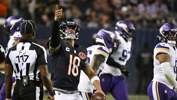 Bears quarterback Caleb Williams (18) reacts against the Vikings