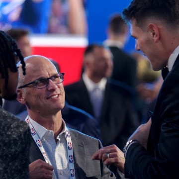Jun 26, 2024; Brooklyn, NY, USA; Connecticut Huskies head coach Dan Hurley talks to Stephon Castle (left) and Donovan Clingan (right) before the start of the first round of the 2024 NBA Draft at Barclays Center. Mandatory Credit: Brad Penner-USA TODAY Sports