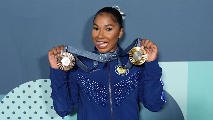 Aug 5, 2024; Paris, France; Jordan Chiles of the United States poses for a photo with her gold and bronze medasl after day three of the gymnastics event finals during the Paris 2024 Olympic Summer Games. 