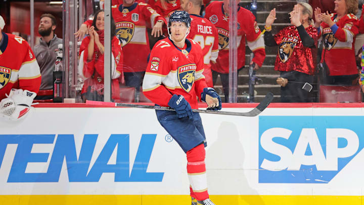 May 24, 2025; Sunrise, Florida, USA; Florida Panthers defenseman Niko Mikkola (77) celebrates after a goal during the third period against the Carolina Hurricanes in game three of the Eastern Conference Final of the 2025 Stanley Cup Playoffs at Amerant Bank Arena. Mandatory Credit: Sam Navarro-Imagn Images