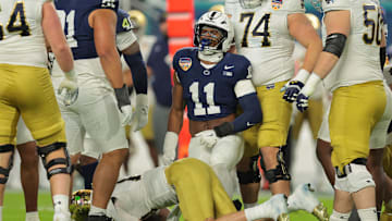 Jan 9, 2025; Miami, FL, USA; Penn State Nittany Lions defensive end Abdul Carter (11) celebrates a tackle on Notre Dame Fighting Irish quarterback Riley Leonard (13) in the first half at Hard Rock Stadium. Mandatory Credit: Sam Navarro-Imagn Images