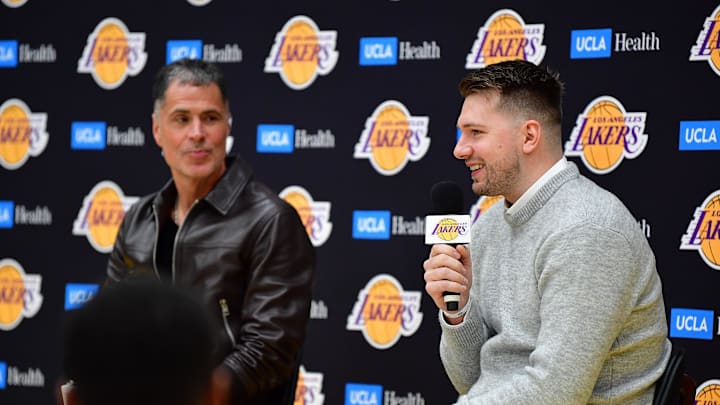 Los Angeles Lakers general manager Rob Pelinka looks at Luka Doncic during his introductory press conference. Los Angeles Lakers general manager Rob Pelinka looks at Luka Doncic during his introductory press conference.