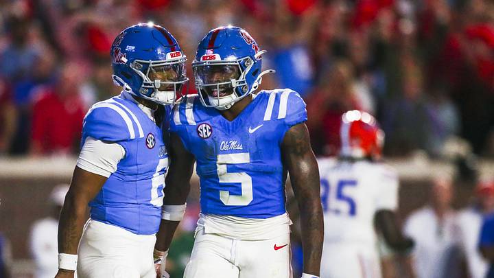 Nov 15, 2025; Oxford, Mississippi, USA; Mississippi Rebels running back Kewan Lacy (5) celebrates with quarterback Trinidad Chambliss (6) after rushing for a touchdown against the Florida Gators during the first quarter at Vaught-Hemingway Stadium. Mandatory Credit: Petre Thomas-Imagn Images