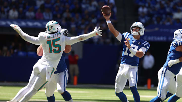 Indianapolis Colts quarterback Daniel Jones (17) throws a touchdown against Miami Dolphins linebacker Jaelan Phillips (15) during the first half at Lucas Oil Stadium. Indianapolis Colts quarterback Daniel Jones (17) throws a touchdown against Miami Dolphins linebacker Jaelan Phillips (15) during the first half at Lucas Oil Stadium.
