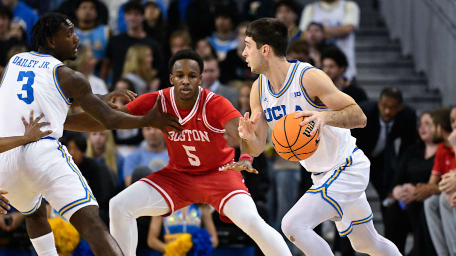 UCLA guard Lazar Stefanovic drives against Boston University guard Kyrone Alexander.