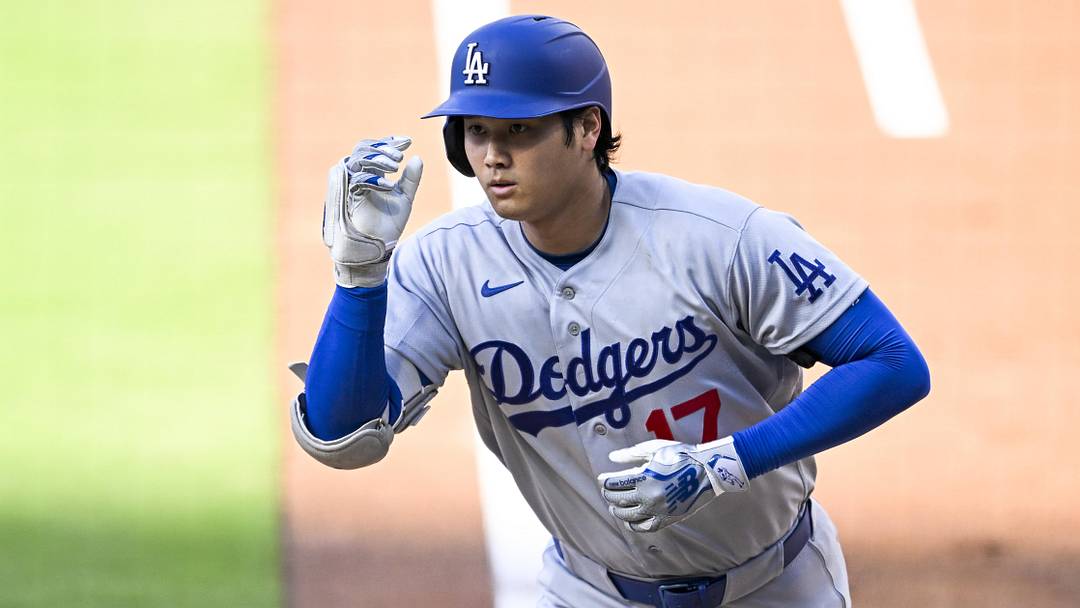 May 20, 2026; San Diego, California, USA; Los Angeles Dodgers designated hitter Shohei Ohtani (17) crosses the plate after hitting a solo home run during the first inning as San Diego Padres third baseman Manny Machado (13) looks on at Petco Park. Mandatory Credit: Denis Poroy-Imagn Images