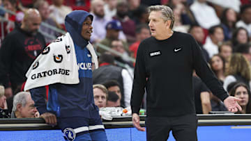 Dec 27, 2024; Houston, Texas, USA; Minnesota Timberwolves head coach Chris Finch talks with guard Anthony Edwards (5) during the fourth quarter against the Houston Rockets at Toyota Center. Mandatory Credit: Troy Taormina-Imagn Images