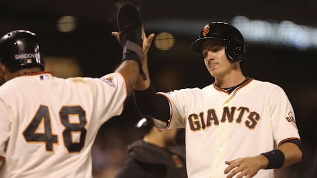 Brett Pill of San Francisco Giants high fives teammates