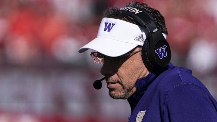 Oct 26, 2024; Bloomington, Indiana, USA; Washington Huskies head coach Jed Fisch looks at his play sheet during the first quarter against the Indiana Hoosiers at Memorial Stadium. Mandatory Credit: Jacob Musselman-Imagn Images