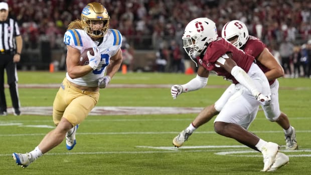 UCLA Bruins running back Carson Steele (left) carries the ball against Stanford Cardinal cornerback Collin Wright