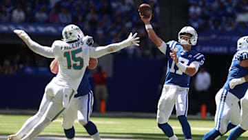 Sep 7, 2025; Indianapolis, Indiana, USA; Indianapolis Colts quarterback Daniel Jones (17) throws a touchdown against Miami Dolphins linebacker Jaelan Phillips (15) during the first half at Lucas Oil Stadium. Mandatory Credit: Trevor Ruszkowski-Imagn Images
