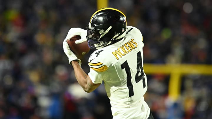 Jan 15, 2024; Orchard Park, New York, USA; Pittsburgh Steelers wide receiver George Pickens (14) makes a catch in the first half against the Buffalo Bills in a 2024 AFC wild card game at Highmark Stadium. Mandatory Credit: Mark Konezny-USA TODAY Sports