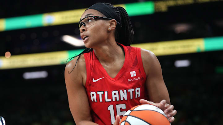 Atlanta Dream guard Allisha Gray gathers a ball during the WNBA All-Star Game 3-point contest at Footprint Center in Phoenix on Friday, July 19, 2024.