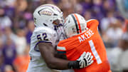 September 9, 22023 in Charlottesville, Virginia; James Madison Dukes offensive lineman Tyshawn Wyatt (52) blocks Virginia Cavaliers defensive end Paul Akere (1) during the first half of the game at Scott Stadium.  Mandatory Credit: Hannah Pajewski-Imagn Images