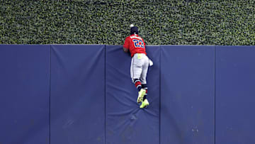 Jun 22, 2025; Miami, Florida, USA;  Atlanta Braves center fielder Michael Harris II (23) climbs the outfield wall but can't catch a homerun against the Miami Marlins during the second inning at loanDepot Park. Mandatory Credit: Rhona Wise-Imagn Images
