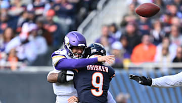 Chicago Bears defensive back Jaquan Brisker (9) hits Minnesota Vikings quarterback Kirk Cousins (8) in 2023