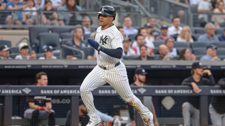 Jun 5, 2024; Bronx, New York, USA; New York Yankees right fielder Juan Soto (22) scores a run on a single by designated hitter Giancarlo Stanton (27) during the first inning against the Minnesota Twins at Yankee Stadium. Mandatory Credit: Vincent Carchietta-USA TODAY Sports