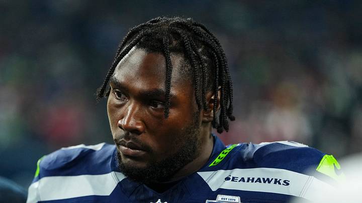 Charles Cross of the Seattle Seahawks watches play