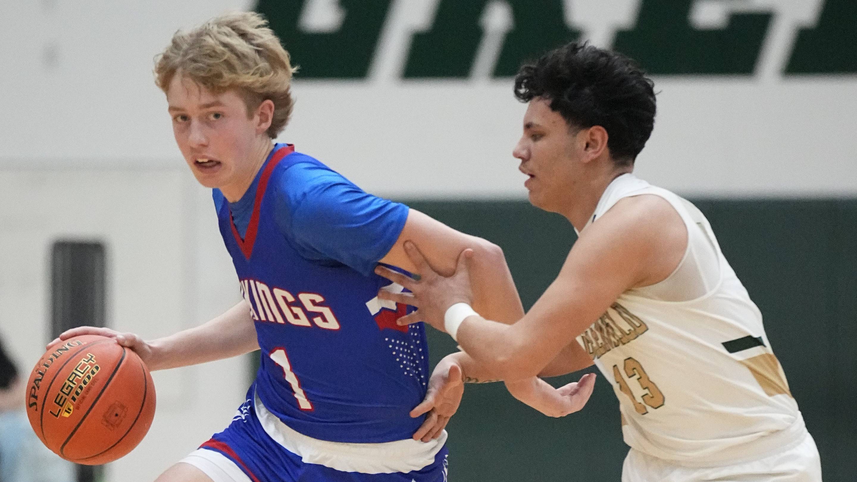 Wisconsin Lutheran's Kager Knueppel (1) works to get past Greenfield's Jayden Valdez (13) during the game on February 26, 2025. Wisconsin Lutheran won the game, 93-59.