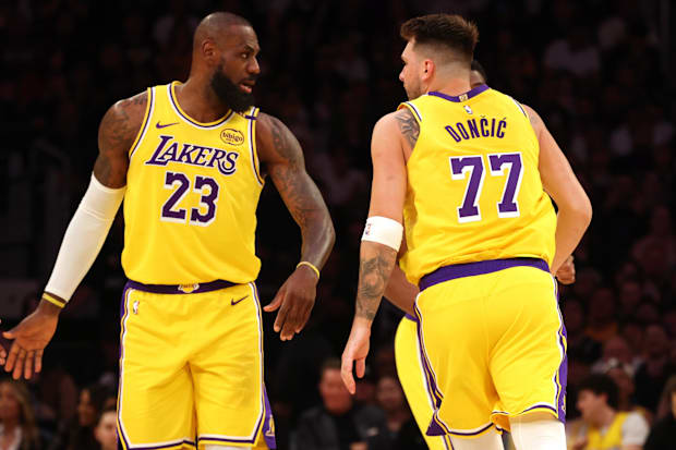 Los Angeles Lakers forward LeBron James (23) and guard Luka Doncic (77)
