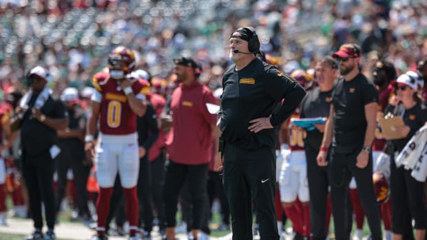 Aug 10, 2024; East Rutherford, New Jersey, USA; Washington Commanders head coach Dan Quinn looks on during a replay review du