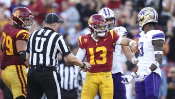 Nov 4, 2023; Los Angeles, California, USA; USC Trojans quarterback Caleb Williams (13) interacts with Washington Huskies safety Mishael Powell (3) after Caleb Williams (13) scores a touchdown during the first quarter against the Washington Huskies at United Airlines Field at Los Angeles Memorial Coliseum. Mandatory Credit: Jessica Alcheh-USA TODAY Sports