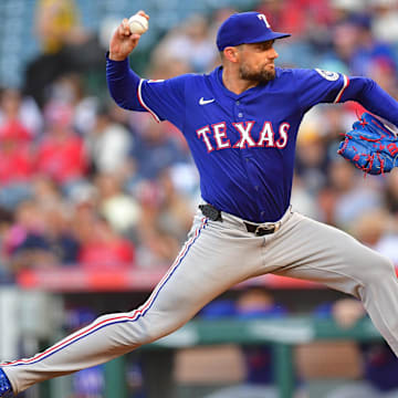 Jul 30, 2025; Anaheim, California, USA; Texas Rangers pitcher Nathan Eovaldi (17) throws against the Los Angeles Angels during the first inning at Angel Stadium.