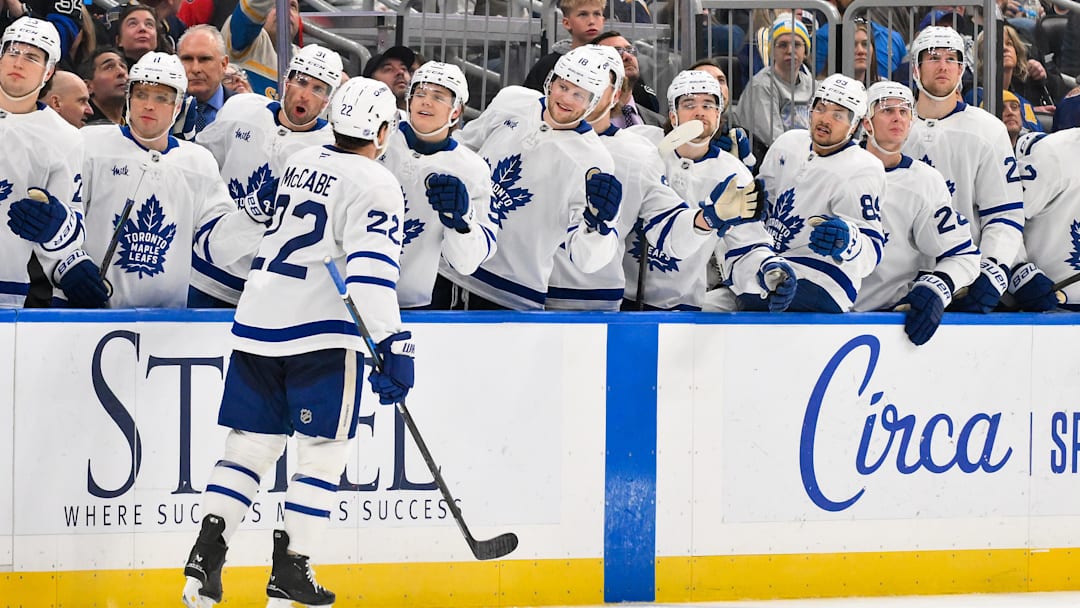 Mar 28, 2026; St. Louis, Missouri, USA; Toronto Maple Leafs defenseman Jake McCabe (22) is congratulated by teammates after scoring against the St. Louis Blues during the third period at Enterprise Center. Mandatory Credit: Jeff Curry-Imagn Images