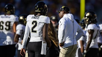 Colorado Buffaloes head coach Deion Sanders with son and quarterback Shedeur Sanders (2)