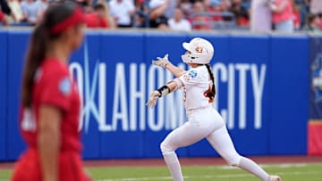 Texas' Leighann Goode (43) celebrates a home run in the first inning during the Women's College World Series championship game between Texas Tech and Texas at Devon Park, Friday, June, 6, 2025, in Oklahoma City.