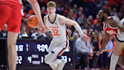 Feb 2, 2025; Champaign, Illinois, USA; Illinois Fighting Illini guard Kasparas Jakucionis (32) drives the ball during the first half against the Ohio State Buckeyes at State Farm Center. Mandatory Credit: Ron Johnson-Imagn Images