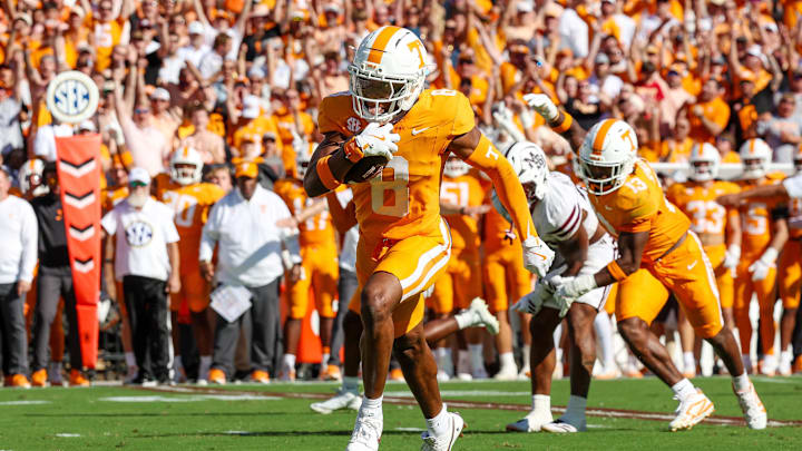 Sep 27, 2025; Starkville, Mississippi, USA; Tennessee Volunteers defensive back Colton Hood (8) runs with the ball after an interception against the Mississippi State Bulldogs during the first half at Davis Wade Stadium at Scott Field. Mandatory Credit: Wesley Hale-Imagn Images