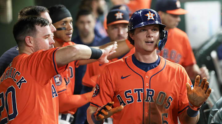 Sep 6, 2024; Houston, Texas, USA;  Houston Astros center fielder Chas McCormick (20) celebrates center fielder Jake Meyers (6) run against the Arizona Diamondbacks in the sixth inning at Minute Maid Park.