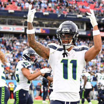 Dec 24, 2023; Nashville, Tennessee, USA; Seattle Seahawks wide receiver Jaxon Smith-Njigba (11) celebrates after a touchdown by tight end Colby Parkinson (84) during the second half against the Tennessee Titans at Nissan Stadium. Mandatory Credit: Christopher Hanewinckel-USA TODAY Sports