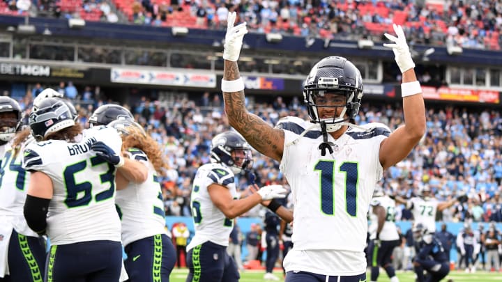 Dec 24, 2023; Nashville, Tennessee, USA; Seattle Seahawks wide receiver Jaxon Smith-Njigba (11) celebrates after a touchdown by tight end Colby Parkinson (84) during the second half against the Tennessee Titans at Nissan Stadium. Mandatory Credit: Christopher Hanewinckel-USA TODAY Sports