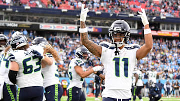 Dec 24, 2023; Nashville, Tennessee, USA; Seattle Seahawks wide receiver Jaxon Smith-Njigba (11) celebrates after a touchdown by tight end Colby Parkinson (84) during the second half against the Tennessee Titans at Nissan Stadium. Mandatory Credit: Christopher Hanewinckel-USA TODAY Sports