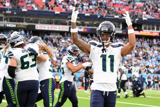  Seattle Seahawks wide receiver Jaxon Smith-Njigba (11) celebrates after a touchdown by tight end Colby Parkinson (84).