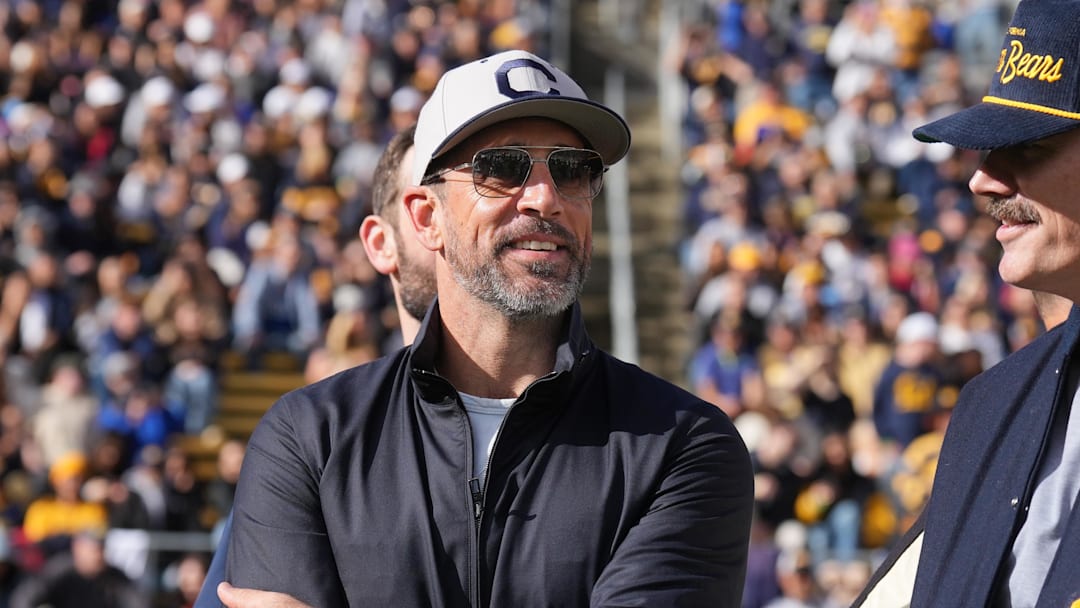 Nov 23, 2024; Berkeley, California, USA; California Golden Bears former quarterback Aaron Rodgers stands on the field before the start of the second quarter against the Stanford Cardinal at California Memorial Stadium. Mandatory Credit: Darren Yamashita-Imagn Images