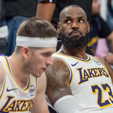Apr 27, 2025; Minneapolis, Minnesota, USA; Los Angeles Lakers forward LeBron James (23) reacts to a replay that confirms he fouled Minnesota Timberwolves guard Anthony Edwards (5) in the fourth quarter during game four of first round for the 2025 NBA Playoffs at Target Center. Mandatory Credit: Matt Blewett-Imagn Images