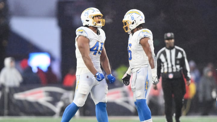 Dec 3, 2023; Foxborough, Massachusetts, USA; Los Angeles Chargers linebacker Tuli Tuipulotu (45) reacts with linebacker Kenneth Murray Jr. (9) after breakup a play against the New England Patriots during the second half at Gillette Stadium. Mandatory Credit: Brian Fluharty-USA TODAY Sports