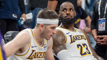 Apr 27, 2025; Minneapolis, Minnesota, USA; Los Angeles Lakers forward LeBron James (23) reacts to a replay that confirms he fouled Minnesota Timberwolves guard Anthony Edwards (5) in the fourth quarter during game four of first round for the 2025 NBA Playoffs at Target Center. Mandatory Credit: Matt Blewett-Imagn Images