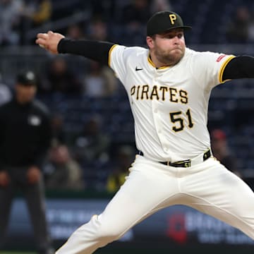 May 19, 2025; Pittsburgh, Pennsylvania, USA;  Pittsburgh Pirates relief pitcher David Bednar (51) pitches against the Cincinnati Reds during the eighth inning at PNC Park. Mandatory Credit: Charles LeClaire-Imagn Images