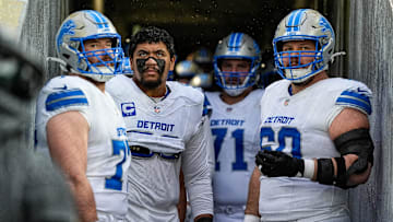 From left, Detroit Lions center Frank Ragnow (77), offensive tackle Penei Sewell (58), guard Kevin Zeitler (71), and guard Graham Glasgow (60) look on from the visiting team tunnel before taking the field for the first half against Green Bay Packers at Lambeau Field in Green Bay, Wis., on Sunday, Nov. 3, 2024.