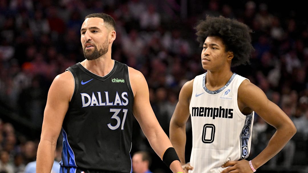 Nov 22, 2025; Dallas, Texas, USA; Dallas Mavericks guard Klay Thompson (31) and Memphis Grizzlies forward Jaylen Wells (0) look on during the game between the Mavericks and the Grizzlies at American Airlines Center. Mandatory Credit: Jerome Miron-Imagn Images