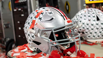 Jan 20, 2025; Atlanta, GA, USA; Detailed view of confetti with an Ohio State Buckeyes helmet after winning the CFP National Championship college football game at Mercedes-Benz Stadium. Mandatory Credit: Mark J. Rebilas-Imagn Images