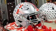Jan 20, 2025; Atlanta, GA, USA; Detailed view of confetti with an Ohio State Buckeyes helmet after winning the CFP National Championship college football game at Mercedes-Benz Stadium. Mandatory Credit: Mark J. Rebilas-Imagn Images